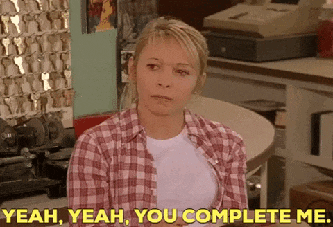 a woman in a plaid shirt says yeah yeah you complete me .
