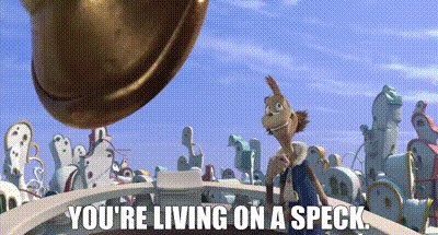 a cartoon character is standing on a bridge with the words you 're living on a speck below him .