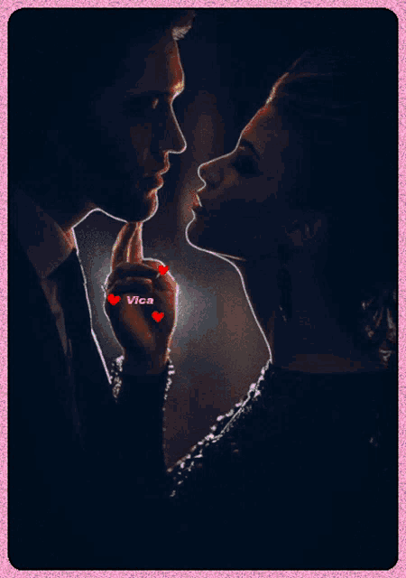 a picture of a man and a woman kissing with the name vica on the bottom