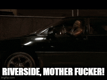 a man is driving a car with a gun in his hand and says riverside mother fucker !