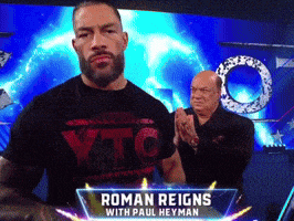 a man in a roman reigns t-shirt with paul heyman