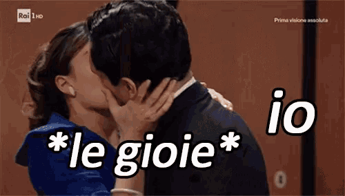 a man and a woman kissing with the words " le gioie " above them