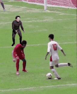 a group of soccer players are playing on a field and one of them has the number 11 on his jersey