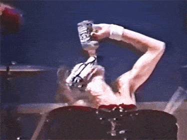 a man is drinking from a bottle that says jack daniel 's