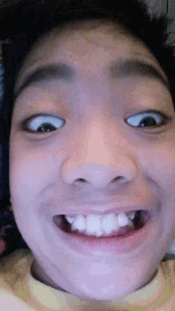 a close up of a person 's face with their mouth open