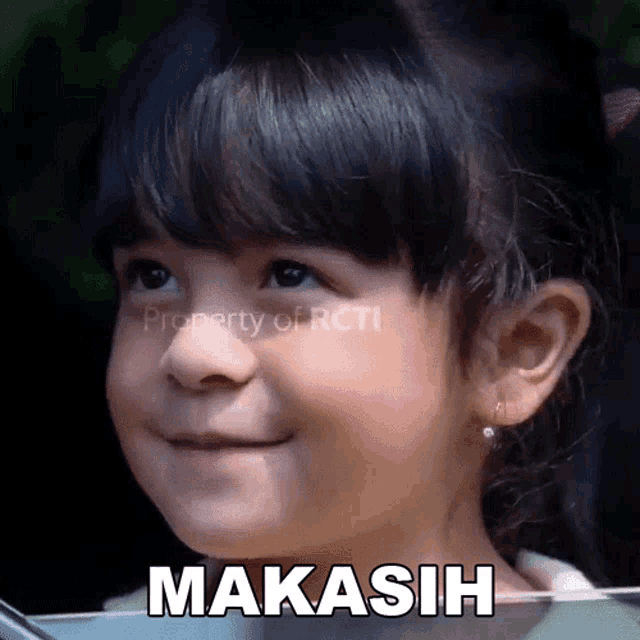 a little girl is smiling with the word makasih written on the bottom