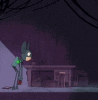 a cartoon character in a bunny costume is walking down a street at night .