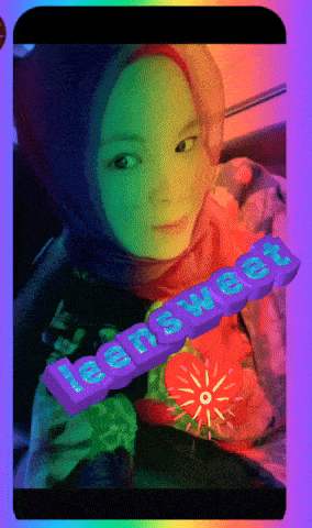 a girl in a hijab is holding a purple sign that says teen sweet