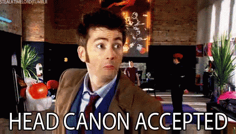 a man in a suit and tie says head canon accepted in a living room