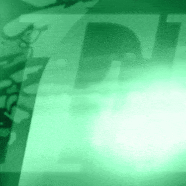 a green background with the letter t on it