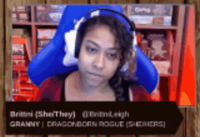a blurred image of a woman wearing headphones with the name britni on the bottom