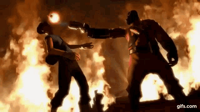 a man is pointing a gun at another man in front of a fire explosion .