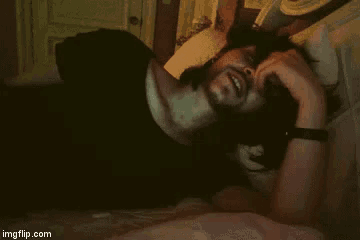 a man is laying on a bed with his head on a pillow with imgflip.com at the bottom of the image
