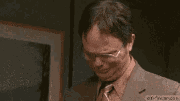 a man with glasses is crying and saying `` thank you '' .