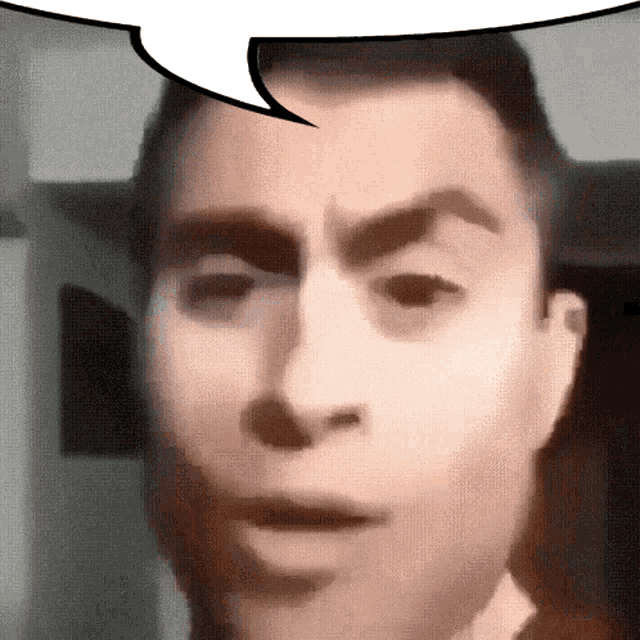 a close up of a man 's face with a white speech bubble above it