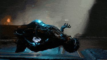 a video game character is laying on the ground with a blue light coming out of his chest