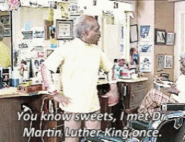 a man standing in a barber shop with the words " you know sweets i met dr martin luther-king once "