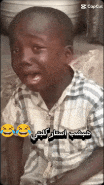 a boy in a plaid shirt is crying with a caption that says capcut on it