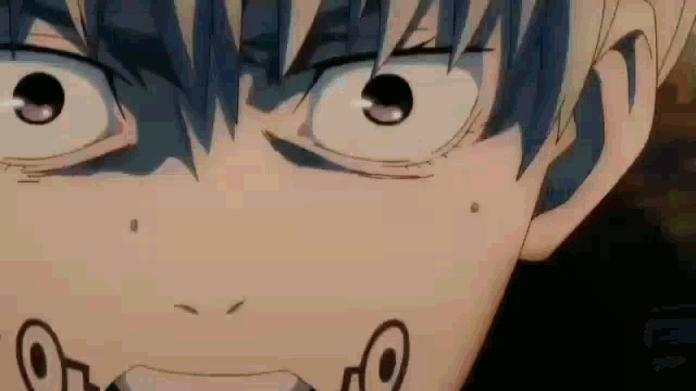 a close up of a person 's face with their mouth open and their eyes closed .