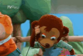 a stuffed monkey with a tv peru logo on the bottom left