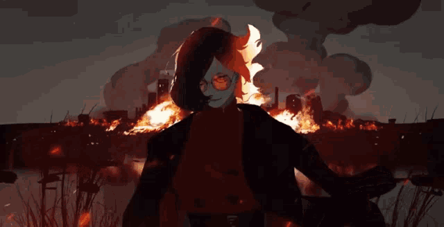 a man standing in front of a burning city
