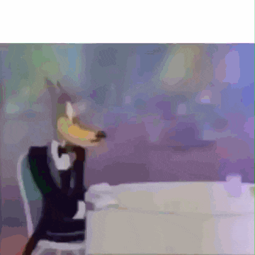 a cartoon wolf in a tuxedo is sitting at a table .