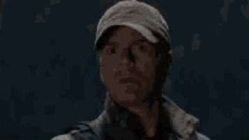 a man wearing a hat and a jacket says okay that 's something .