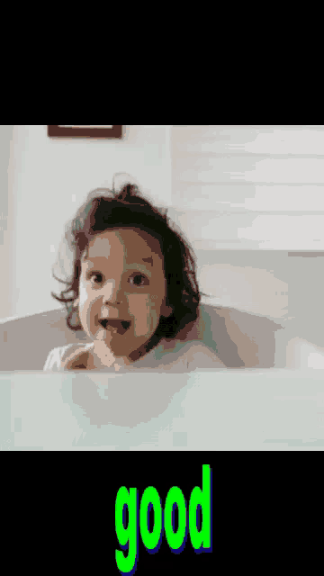 a baby is sitting in a bathtub eating potato chips and the word good is above him