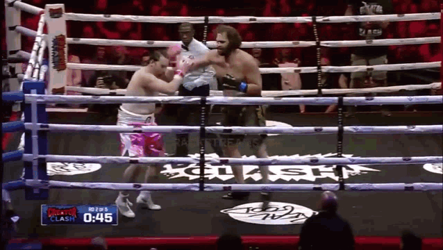 a boxing match is being shown on a screen with the time of 0:45