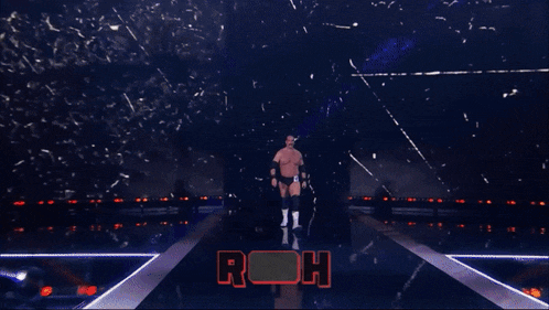 a wrestler named silas young stands in front of a snowy backdrop