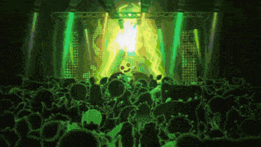 a crowd of people are gathered in front of a stage with a green light coming out of it