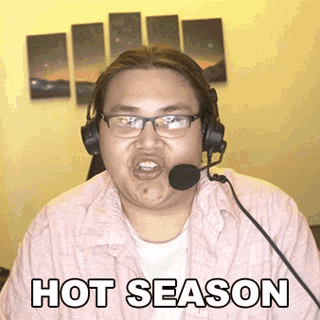 a man wearing headphones and a microphone with the words hot season below him