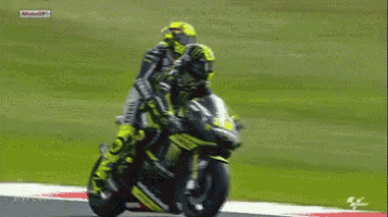 a man riding a motorcycle with the word monster on the front