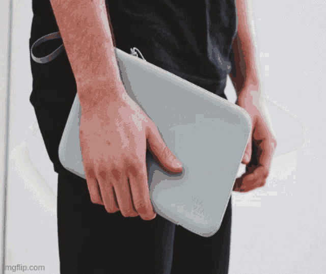 a person holding a cisco case in their hand