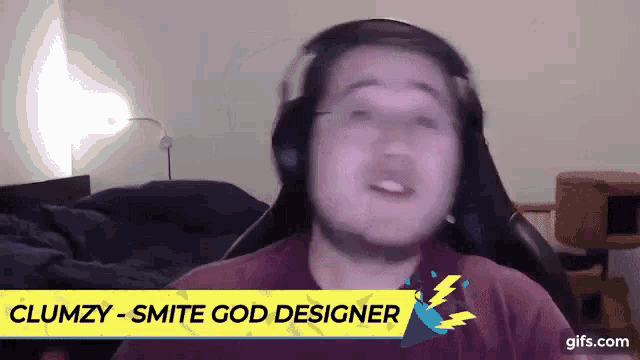 a man wearing headphones with the name clumzy on the bottom of the screen