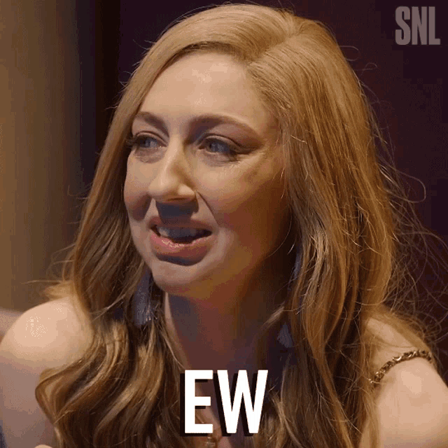a woman with a snl logo behind her