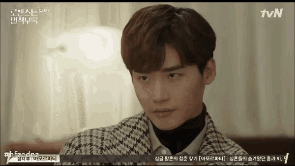 a tvn screen shows a man in a plaid shirt