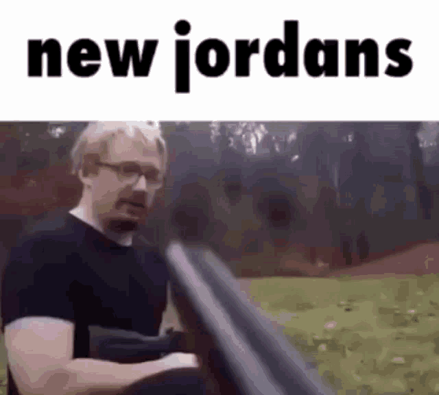 a man is sitting on a bench holding a gun and the words `` new jordans '' are written above him .