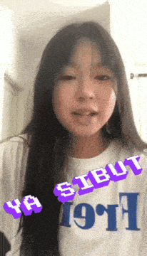 a girl wearing a shirt that says ya sibut