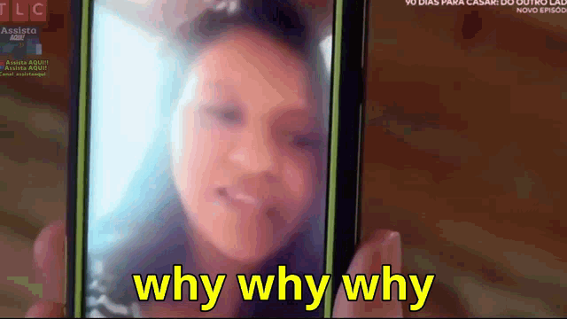 a person is holding a cell phone with the words why why why on the screen