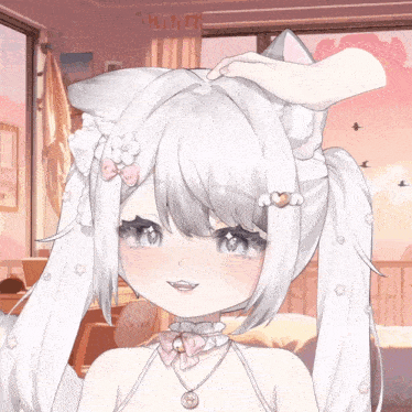 a close up of a girl with white hair and a cat ear