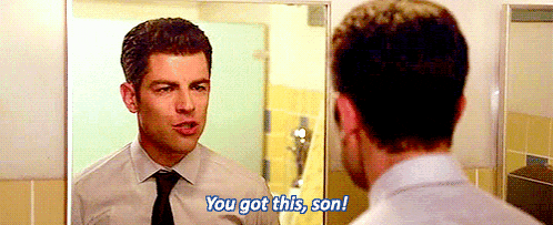 a man in a white shirt and tie is looking at himself in a mirror and says you got this son