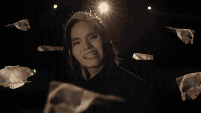 a blurry image of a person 's face with a light shining on it