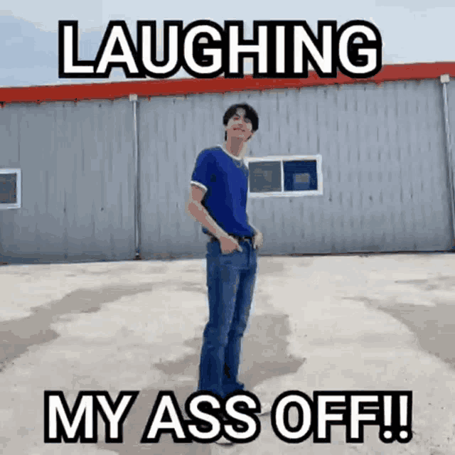 a man in a blue shirt is standing in front of a building with the words laughing my ass off