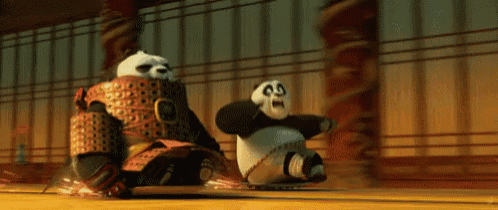 two panda bears are racing each other on a skateboard in a room .