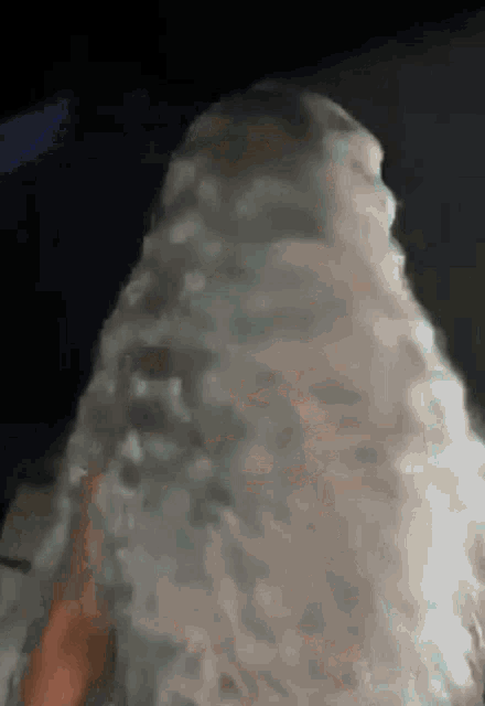 a close up of a person 's face covered in a white cloth