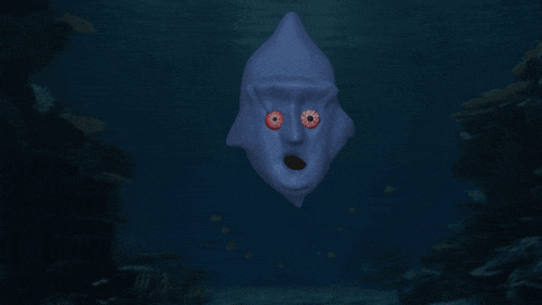 a blue face with red eyes and a surprised expression