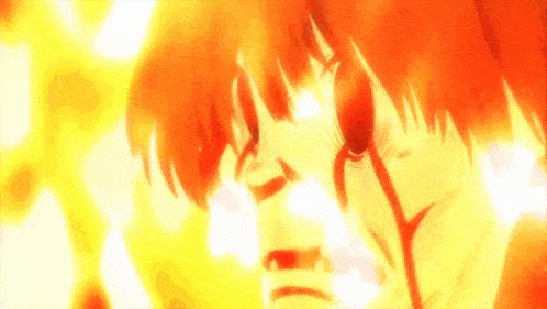 a close up of a person 's face with flames behind him