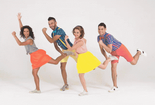 a group of young people are jumping in the air with their arms in the air