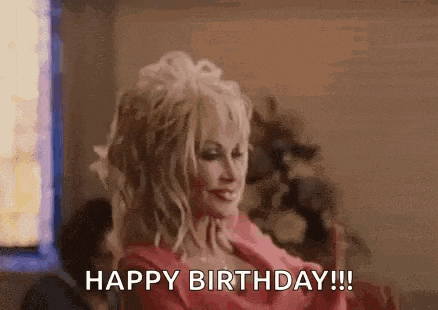 dolly parton is wearing a pink dress and saying `` happy birthday ! ''